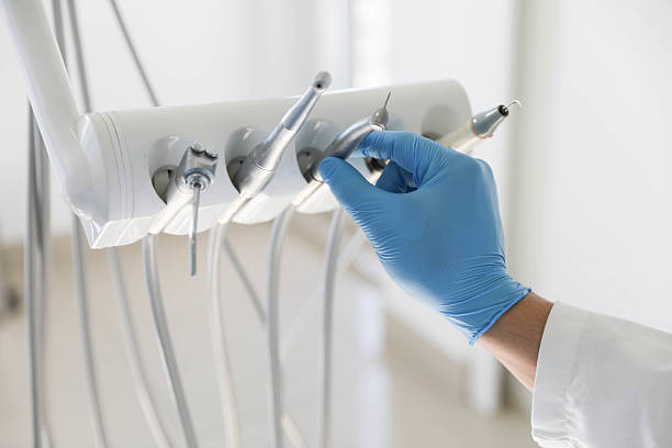 Professional Tooth Extraction technician working in Greilickville, MI